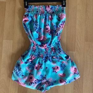 Off the shoulder Floral Romper with pockets.